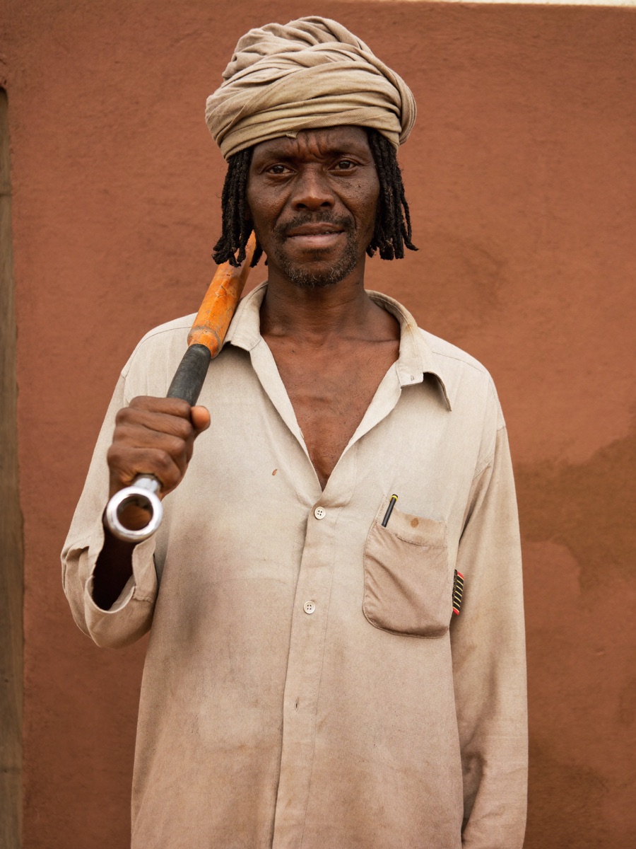 A plumber holding his pipe wrench